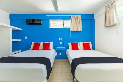 Cama o camas de una habitación en Capital O Hotel El Mejicano, Acapulco