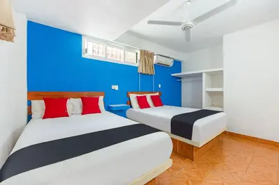 Cama o camas de una habitación en Capital O Hotel El Mejicano, Acapulco