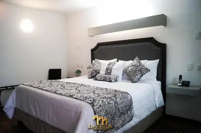Cama o camas de una habitación en HOTEL LOS PORTALES CHIGNAHUAPAN