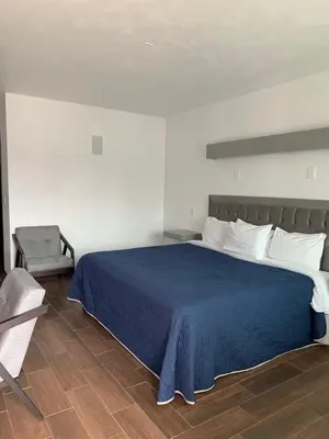 Cama o camas de una habitación en HOTEL LOS PORTALES CHIGNAHUAPAN