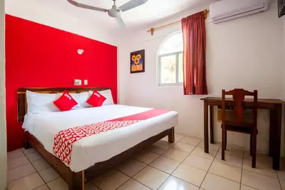 Cama o camas de una habitación en OYO Hotel Betsua Vista Hermosa, Huatulco