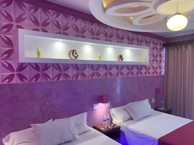 Cama o camas de una habitación en Hotel Boutique TEKALI INN