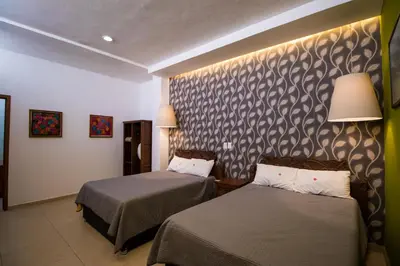 Cama o camas de una habitación en Hotel Santa Rosa
