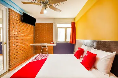 Cama o camas de una habitación en OYO Hotel Rey David, Oaxaca