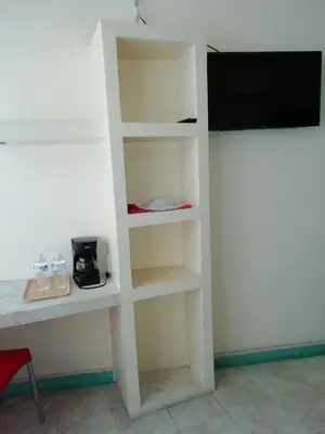 Una televisión o centro de entretenimiento en Posada de Vick
