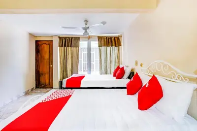 Cama o camas de una habitación en OYO Hotel Margarita