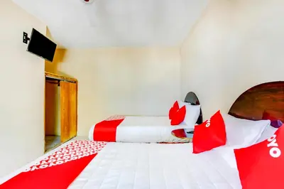 Cama o camas de una habitación en OYO Hotel Margarita
