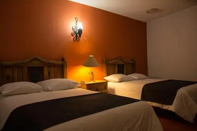 Cama o camas de una habitación en Hotel Posada Santa Bertha