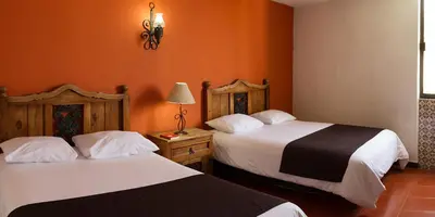 Cama o camas de una habitación en Hotel Posada Santa Bertha