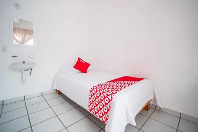 Cama o camas de una habitación en OYO Hotel Posada San Vicente, Huatulco