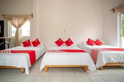 Cama o camas de una habitación en OYO Hotel Posada San Vicente, Huatulco