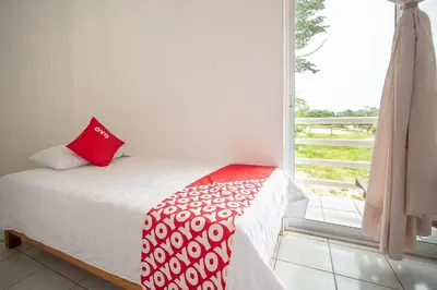 Cama o camas de una habitación en OYO Hotel Posada San Vicente, Huatulco