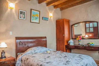 Cama o camas de una habitación en Hotel Casa Pomarrosa