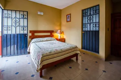 Cama o camas de una habitación en Villa San Francisco Hotel