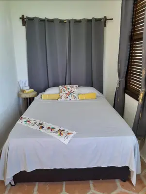 Cama o camas de una habitación en Hotel Quinto Sol