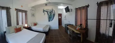 Cama o camas de una habitación en Hotel Quinto Sol