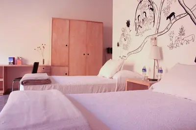 Cama o camas de una habitación en Hotel Cosijo - San Jeronimo Tlacochahuaya