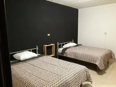 Cama o camas de una habitación en Posada Loreto Xalapa