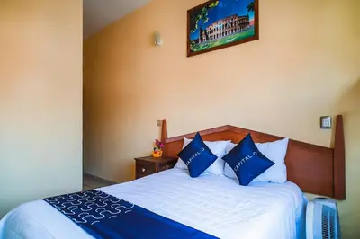 Cama o camas de una habitación en Capital O Hotel Aurora, Tuxtla Gutiérrez