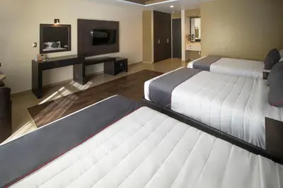 Cama o camas de una habitación en Hotel Las Iglesias, Cholula