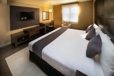 Cama o camas de una habitación en Hotel Las Iglesias, Cholula