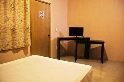 Una televisión o centro de entretenimiento en OYO Hotel Trigos De Oro,San Luis Teolocholco Park