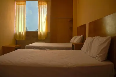 Cama o camas de una habitación en OYO Hotel Trigos De Oro,San Luis Teolocholco Park