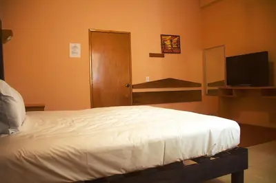 Cama o camas de una habitación en OYO Hotel Trigos De Oro,San Luis Teolocholco Park
