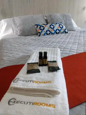 Cama o camas de una habitación en EXECUTIROOMS VERACRUZ
