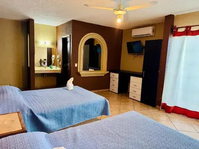 Cama o camas de una habitación en Hotel Cabañas Santa Cruz