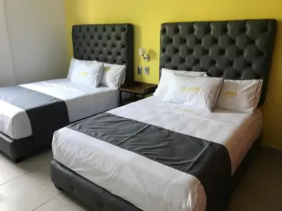Cama o camas de una habitación en Hotel Jar8 Acuario enfrente al Acuario de Veracruz