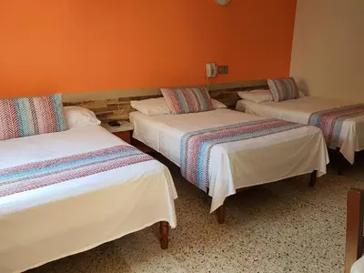 Cama o camas de una habitación en Hotel Atlantico a 150 mts de Playa Martí