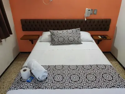 Cama o camas de una habitación en Hotel Atlantico a 150 mts de Playa Martí