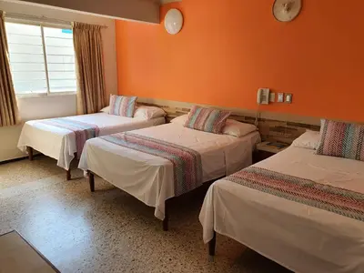 Cama o camas de una habitación en Hotel Atlantico a 150 mts de Playa Martí