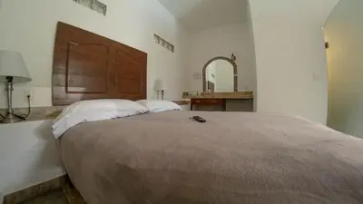 Cama o camas de una habitación en La Buena Suerte