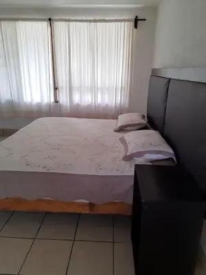Cama o camas de una habitación en Posada Bugambilias