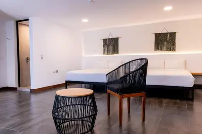 Cama o camas de una habitación en Urban Puebla by Grupo Amber