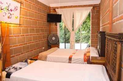 Cama o camas de una habitación en Hospedaje Piedra de Sol