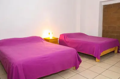 Cama o camas de una habitación en Hospedaje Piedra de Sol