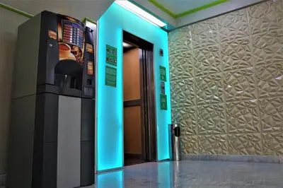 Una televisión o centro de entretenimiento en Hotel Duque