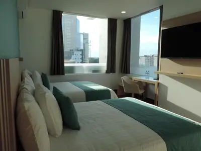Cama o camas de una habitación en Hotel Plaza Sol Veracruz