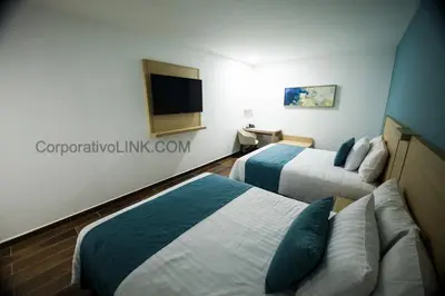 Cama o camas de una habitación en Hotel Plaza Sol Veracruz