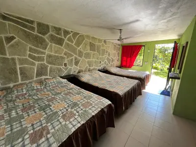 Cama o camas de una habitación en Hotel Villa Aventura