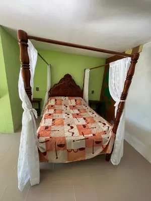 Cama o camas de una habitación en Hotel Villa Aventura