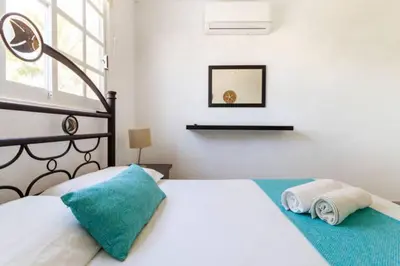 Cama o camas de una habitación en Nuevo en Booking Casa Acapulco Diamante a Pasos de la Playa