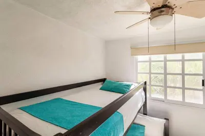 Cama o camas de una habitación en Nuevo en Booking Casa Acapulco Diamante a Pasos de la Playa