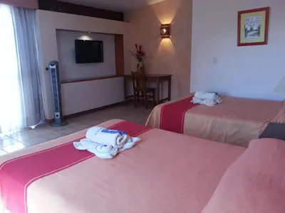 Cama o camas de una habitación en Hotel Casa Arnel