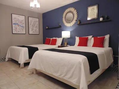 Cama o camas de una habitación en Suites Viveros Coyoacán I Hospedaje a tu medida