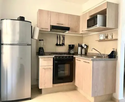Una cocina o zona de cocina en CASABONITA fte alberca, AirAc