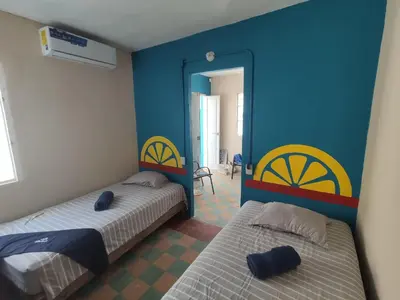 Cama o camas de una habitación en Chuchumbé Hotel & Hostal